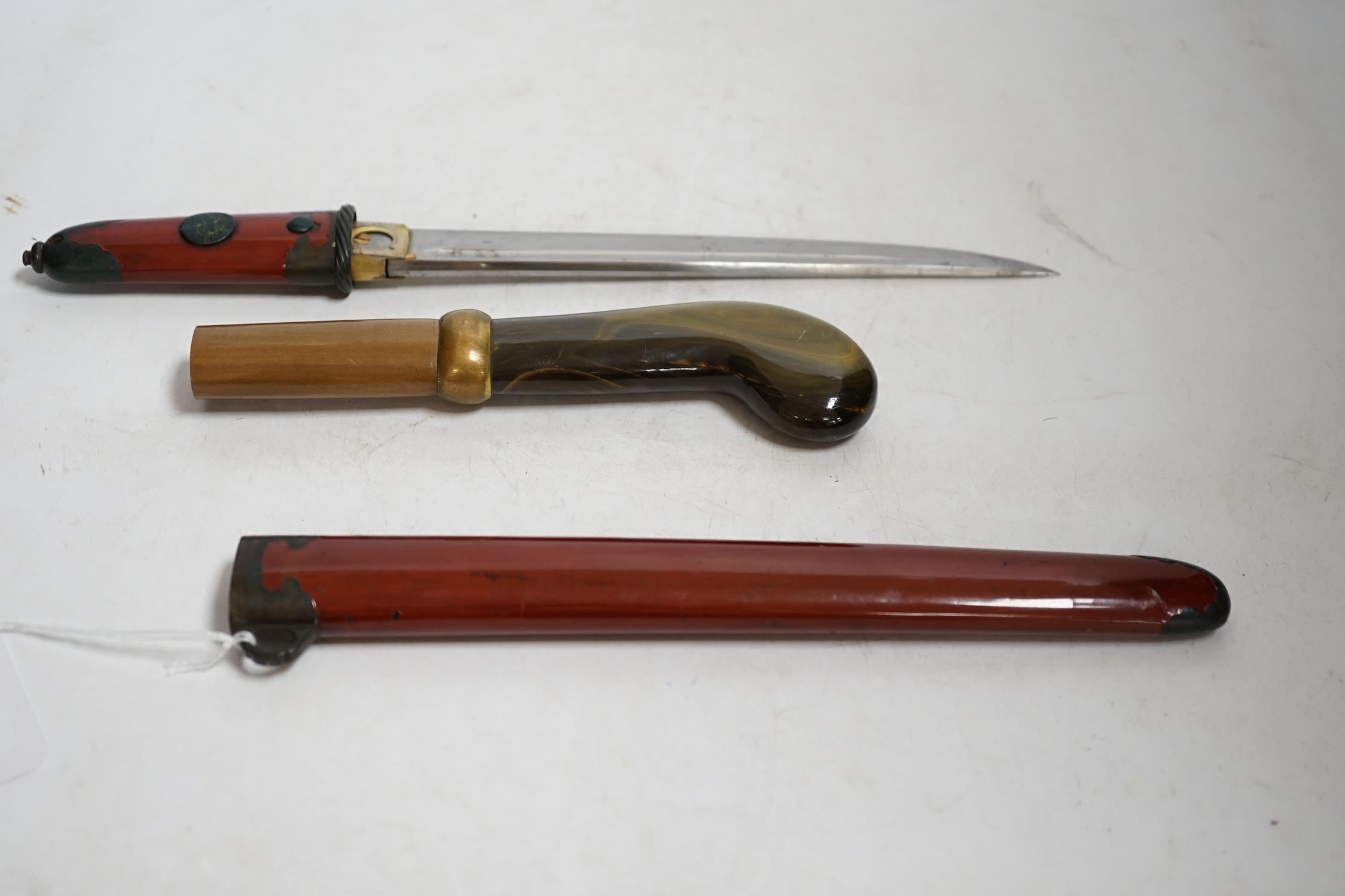 A Japanese knife in lacquered sheath and a handle, largest 34cm in length. Condition - fair to good